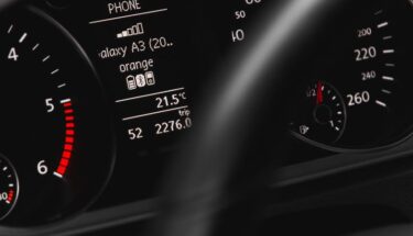 A car dashboard with many light symbols