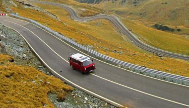 A red van covering several miles on the road to clear check engine light