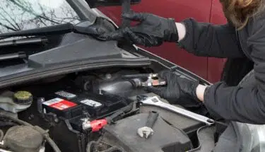 woman checking car battery