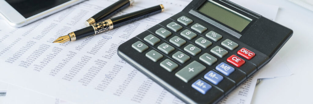 calculator on desk with documents