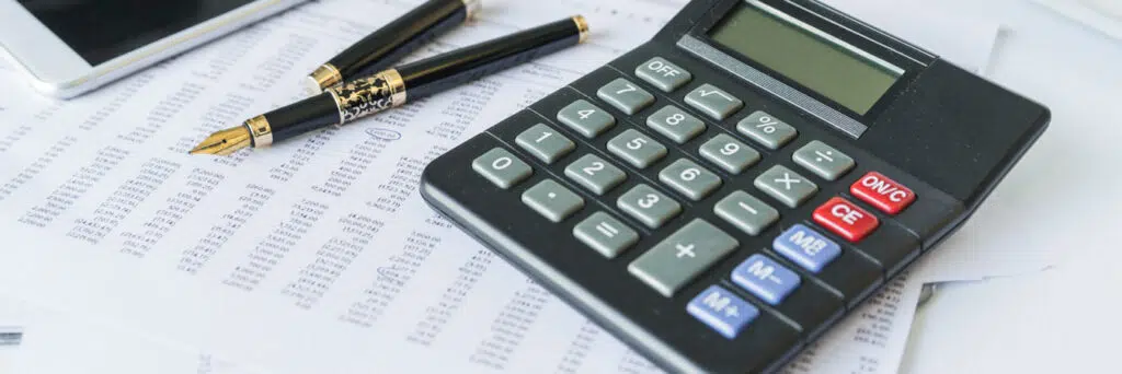 calculator on desk with documents