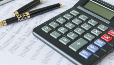 calculator on desk with documents