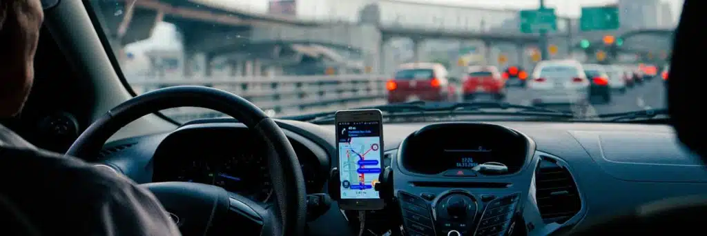 person driving using mobile tracker