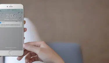 woman holding her mobile phone