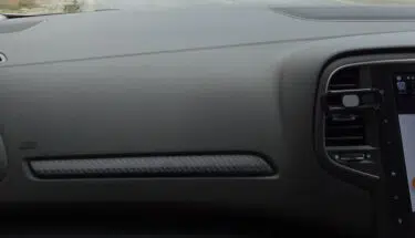 The dashboard of a car with a Waze-enabled GPS device.